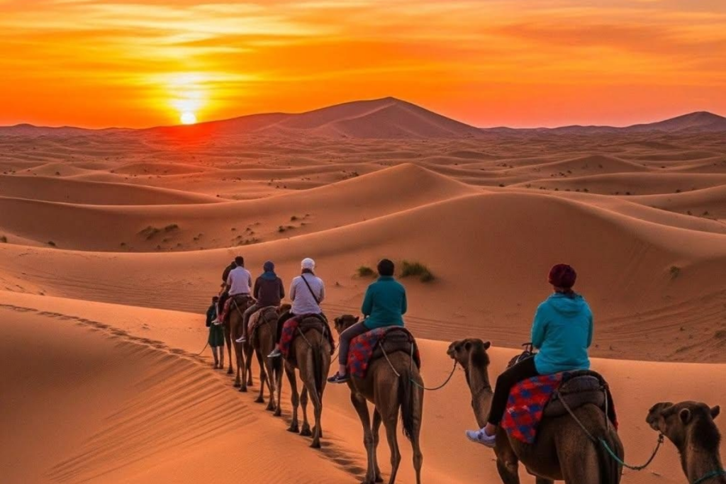 Erg Chebbi golden dunes Merzouga Morocco camel ride sunset orange landscape